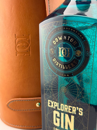 Bottle of Downton Distillery Explorer's Gin with a brown leather case.