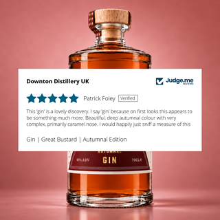 Review over a bottle with 5 stars and text writing on it for Great Bustard Autumnal Gin.