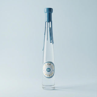 Eau de Vie de Fifteen, on a light blue background. Grape Brandy