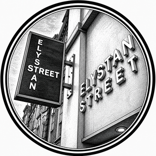 Black and white image of a street sign reading 'Elystan Street' on a building facade.