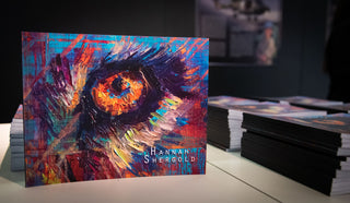 Colorful abstract artwork with 'Hannah Shergold' on a table