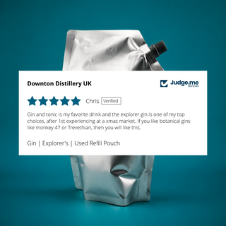 Refill pouch with a white card in front of it. The card has text and shapes on it. It has five stars for Explorer's Gin.
