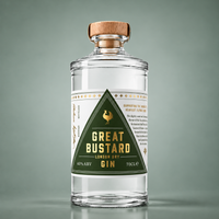 A clear glass bottle of Great Bustard London Dry Gin with a wooden cap and a dark green triangular label, shown on a muted green background.
