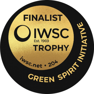 IWSC Green Spirit Initiative finalist trophy badge with gold and black design.