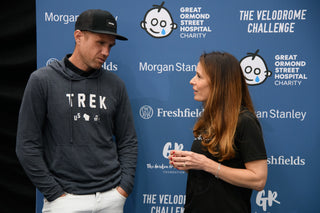 Two people standing in front of a blue backdrop with GOSH, Morgan Stanley logos.
