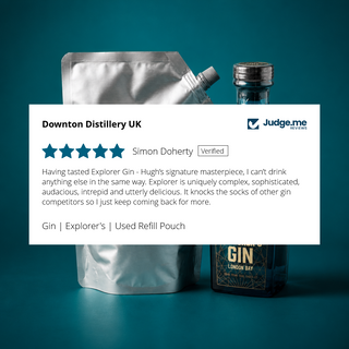 A used silver stainless steel refill pouch for Downton Distillery UK's Explorer Gin, shown next to a bottle of the gin and a white rating card overlay with customer feedback from Judge.me.