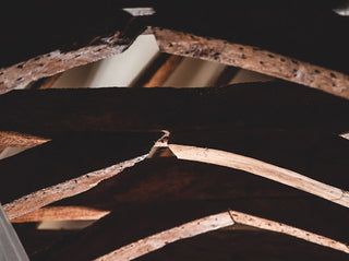 Close-up of wooden beams with a dark background